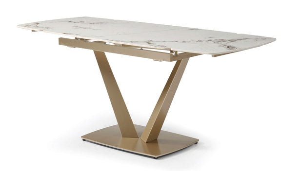 Dining table with white marble-look top and gold geometric pedestal base
