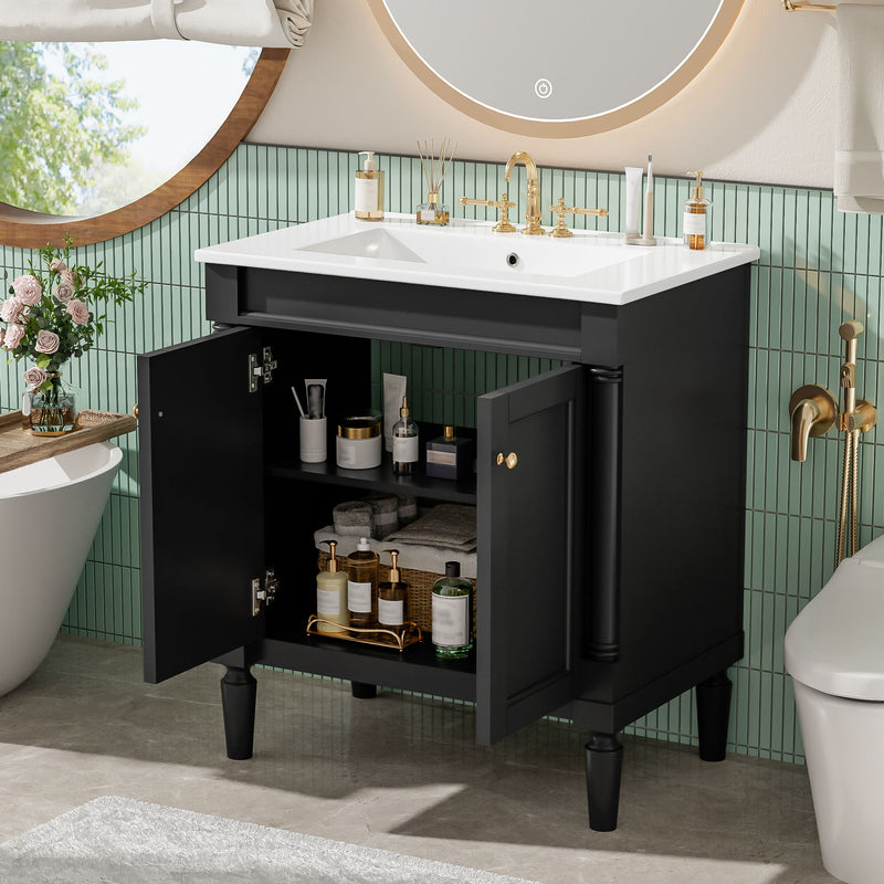 Black bathroom vanity cabinet with sink, open storage cabinet with shelves and bottles