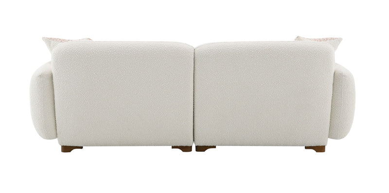 Beige boucle sofa with two toss pillows, rear view