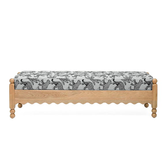 White leopard jacquard upholstered bench with scalloped skirt and wooden legs