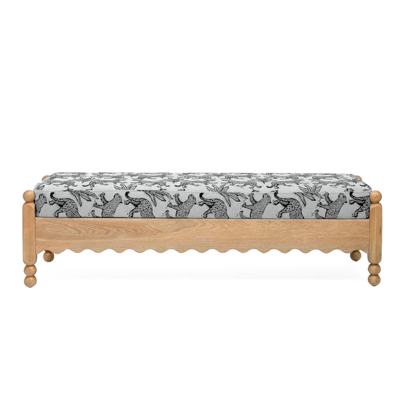 White leopard jacquard upholstered bench with scalloped skirt and wooden legs