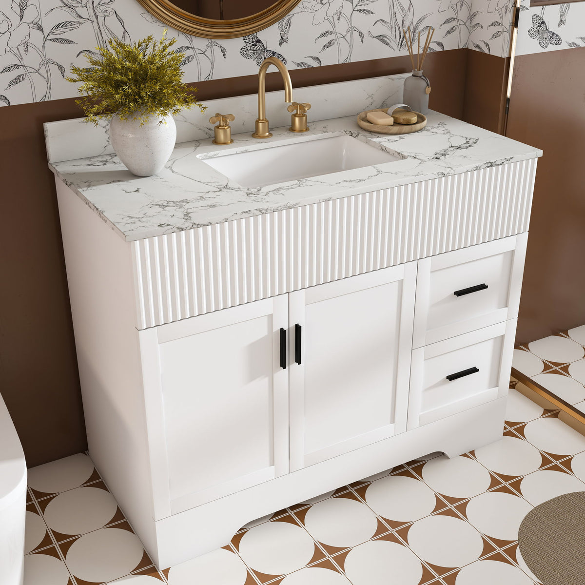 White bathroom vanity with fluted front, marble-look countertop and sink, two drawers