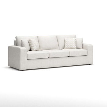 Beige sofa with broad arms, three seat cushions, and patterned accent pillows