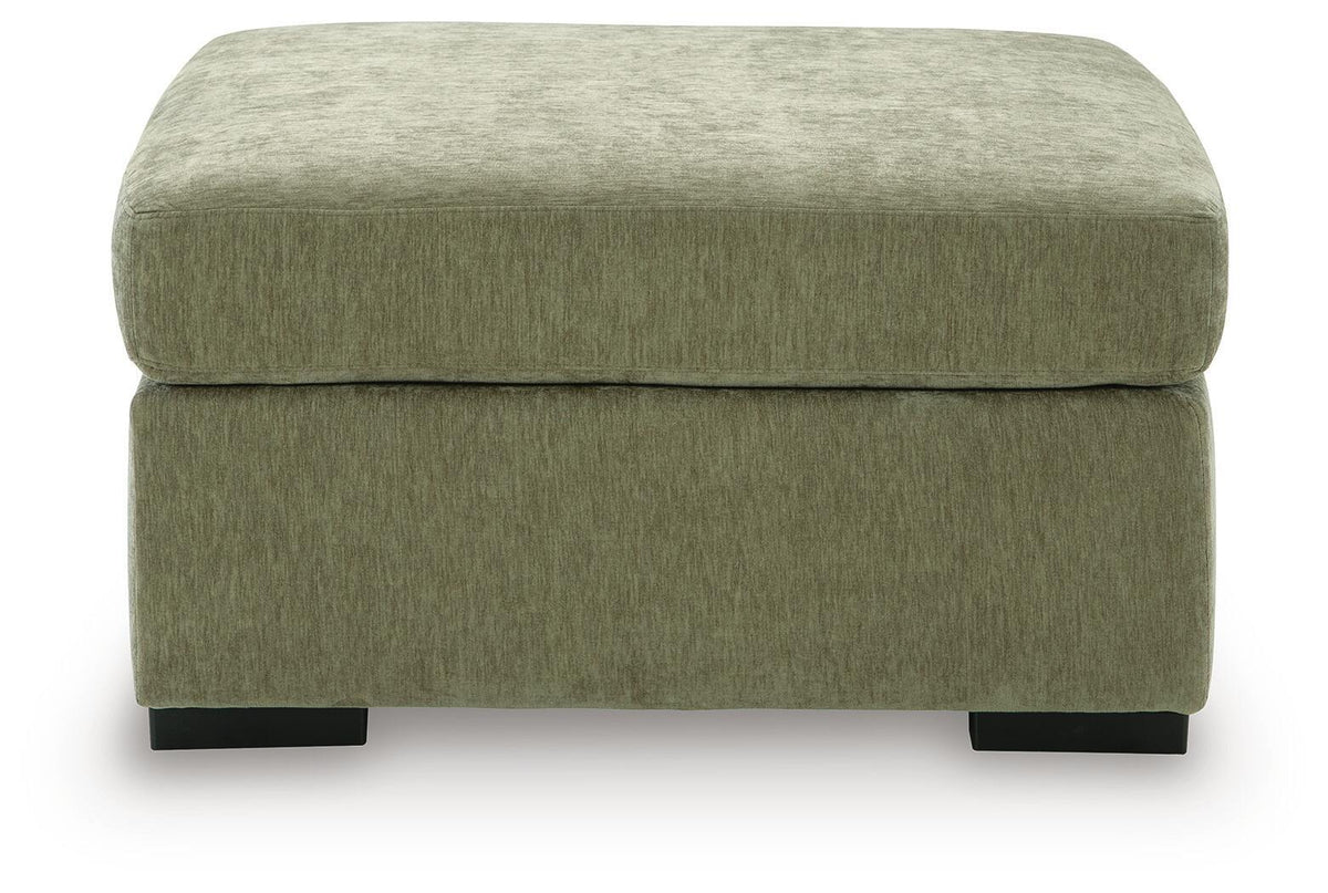 Oversized accent ottoman in green upholstery with low profile and black feet