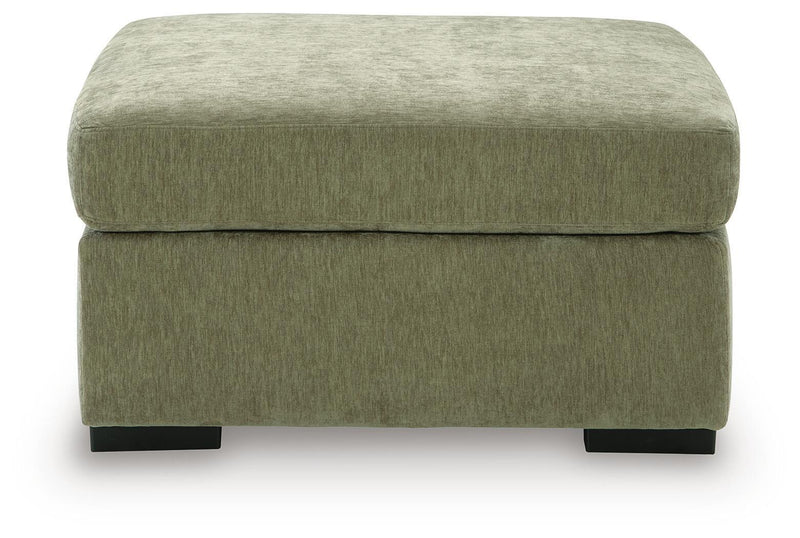 Oversized accent ottoman in green upholstery with low profile and black feet