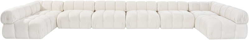 White modular sectional sofa with rounded, tufted seats and cushioned backrest