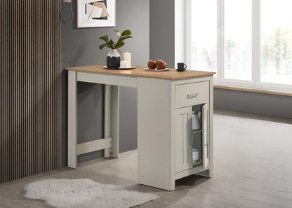 Light gray counter-height dining table with cabinet, drawer, and open shelf