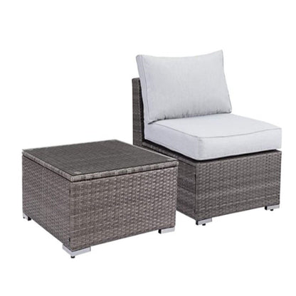 Outdoor patio chair with dark gray wicker and light gray cushion, matching coffee table