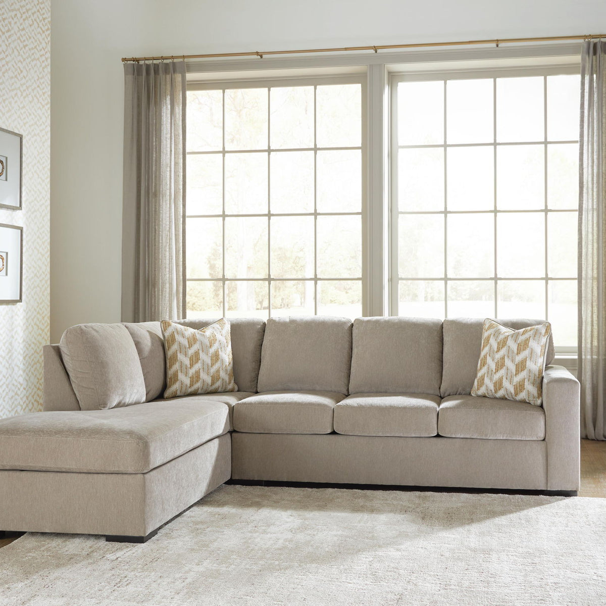 Bridgepoint sectional sofa with chaise, light gray upholstery, decorative patterned pillows