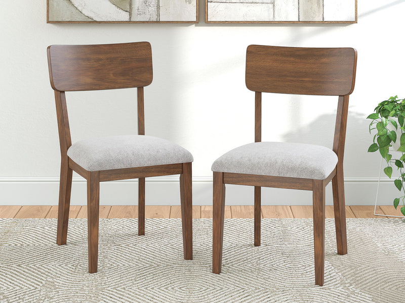 Set of two brown dining side chairs with arched backs and light gray upholstered seats