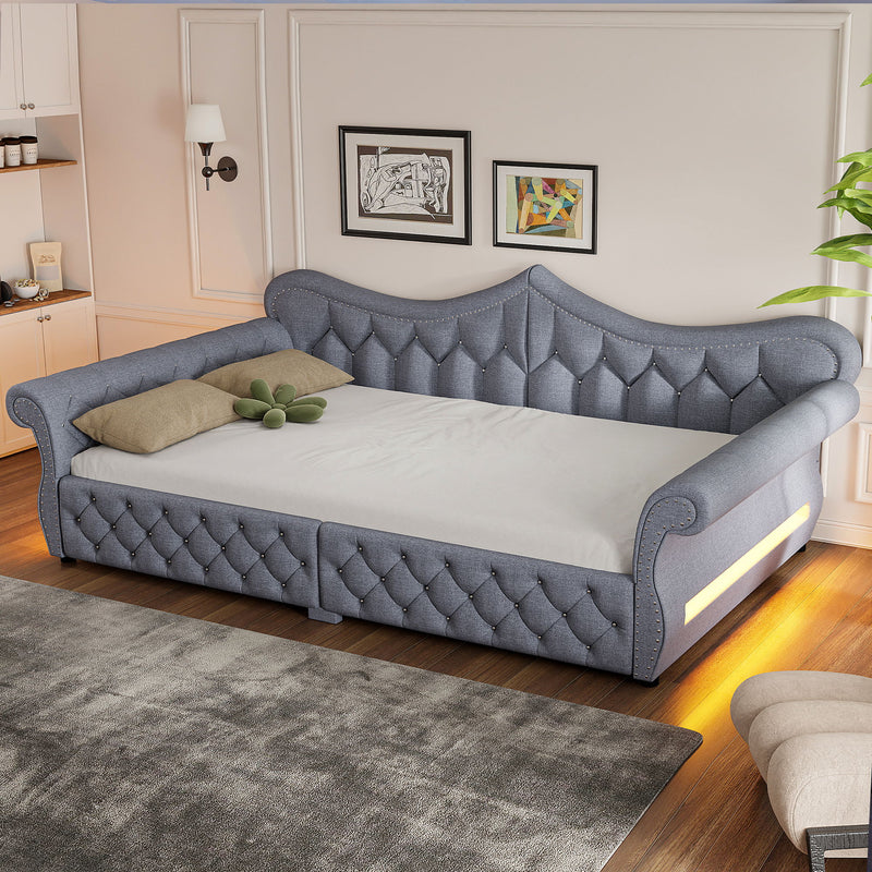 Gray upholstered daybed with tufted back and side LED strip, nailhead trim