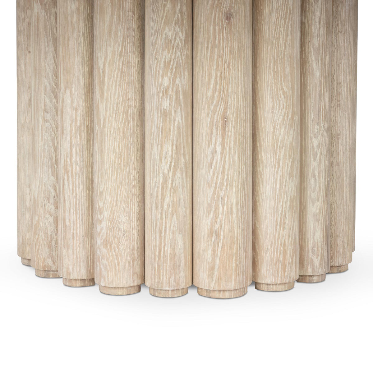 Cream washed dining table base with vertical fluted wood columns.