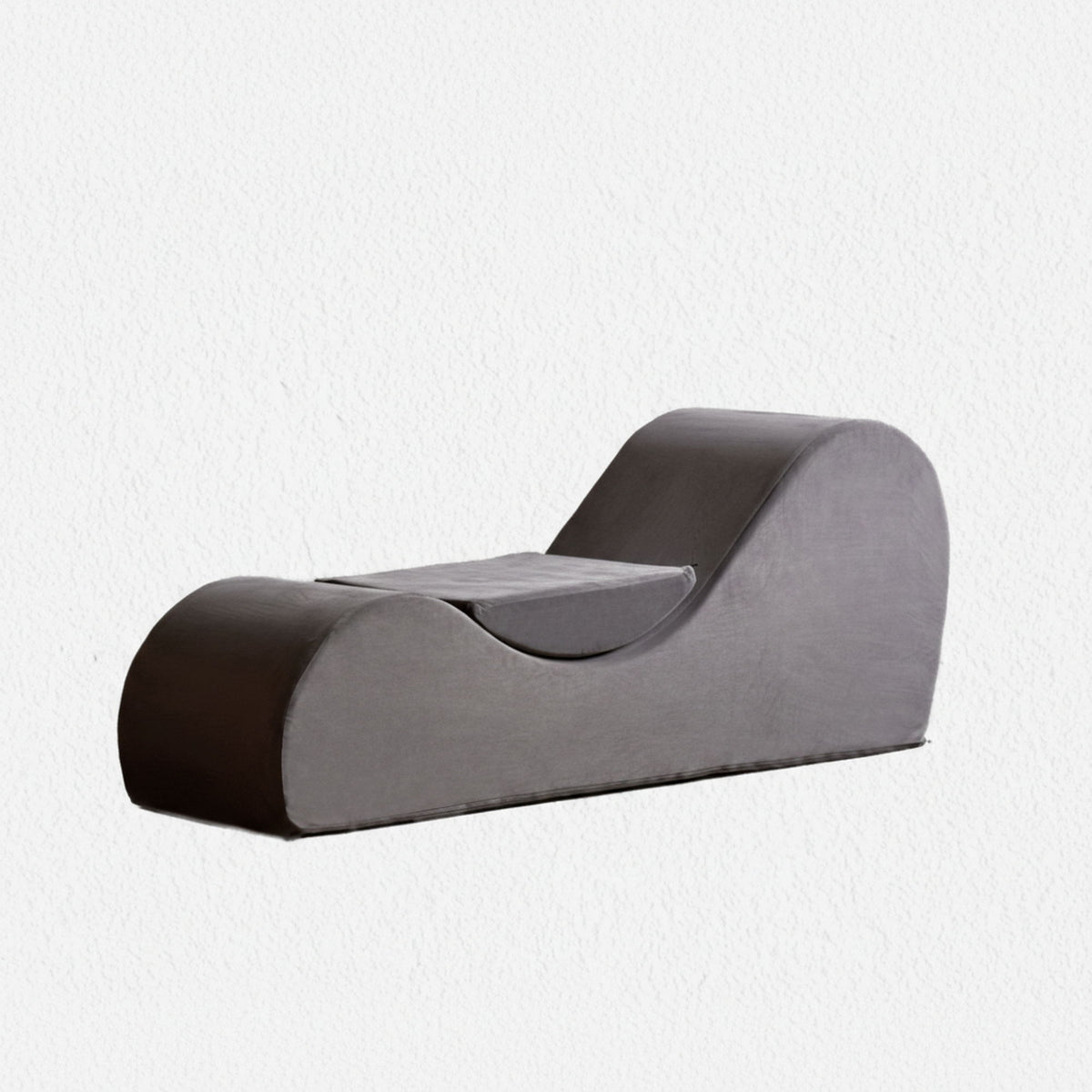 Two-tone chaise lounge chair with curved headrest and thick gray-and-brown upholstery