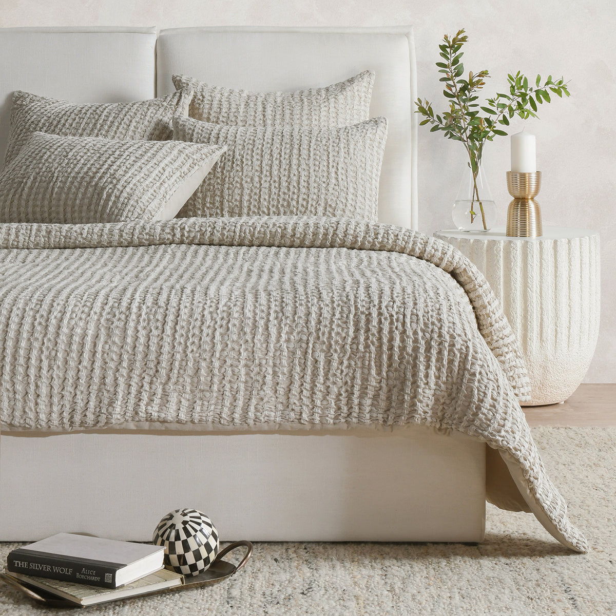 Cream textured square sham pillow cover with waffle-like woven texture