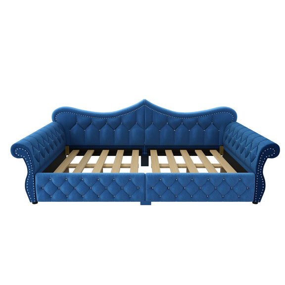 Blue upholstered daybed with tufted panels and slatted base