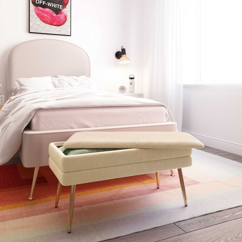 Ziva velvet storage bench in beige with padded rectangular top and gold legs.