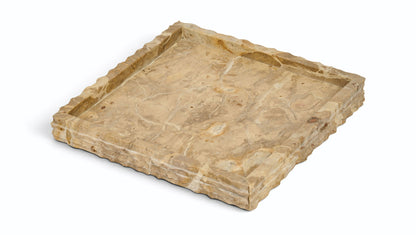 Beige marble tray with natural veining and raised, squared edges.
