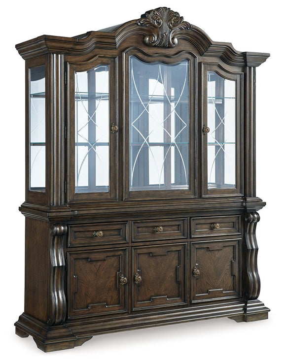 Dark brown wood dining buffet hutch with glass-pane door and carved top trim