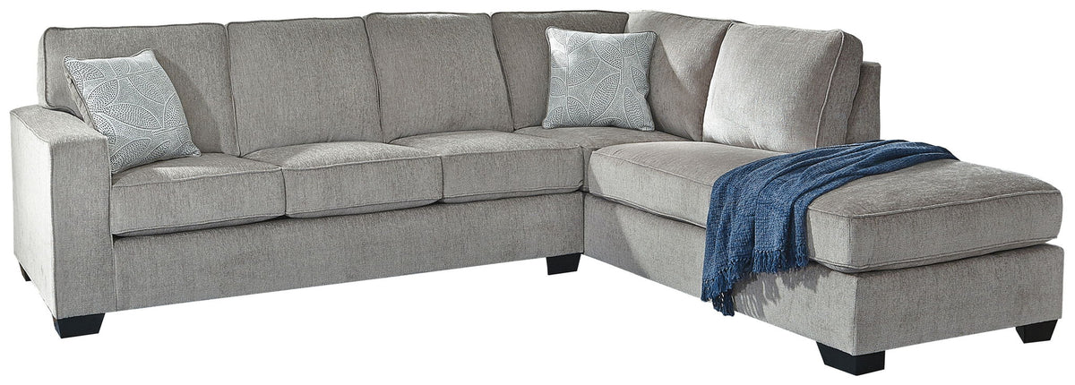 Gray sleeper sectional sofa with chaise corner and dark blue throw blanket