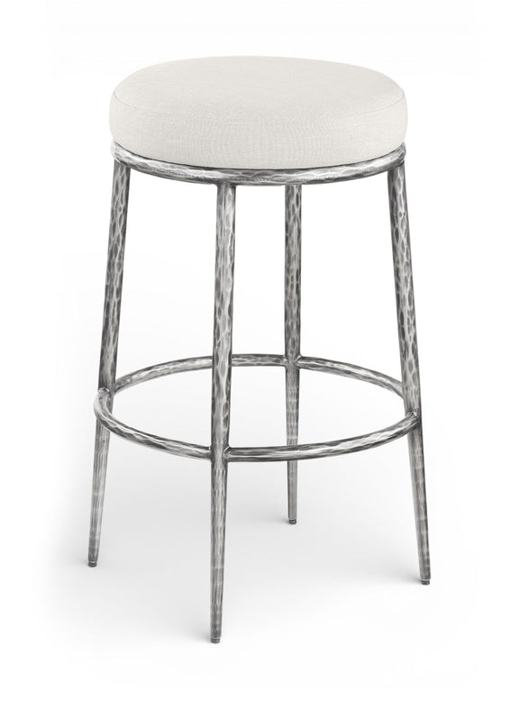 White upholstered round backless bar stool with antique silver metal legs and footrest