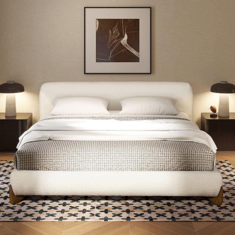 Modern platform bed in white upholstery with tufted headboard and slatted support