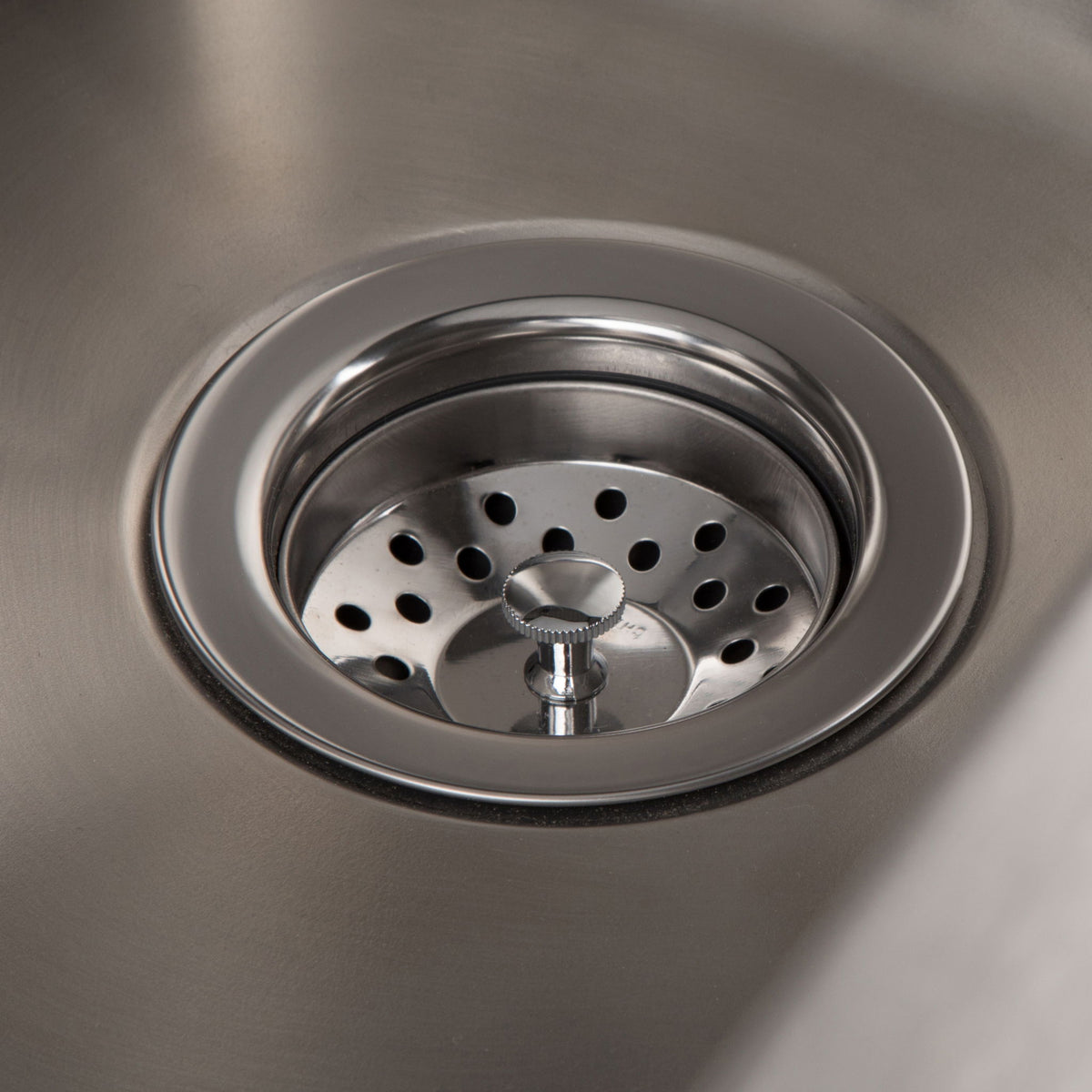 Stainless steel sink drain strainer with circular perforations