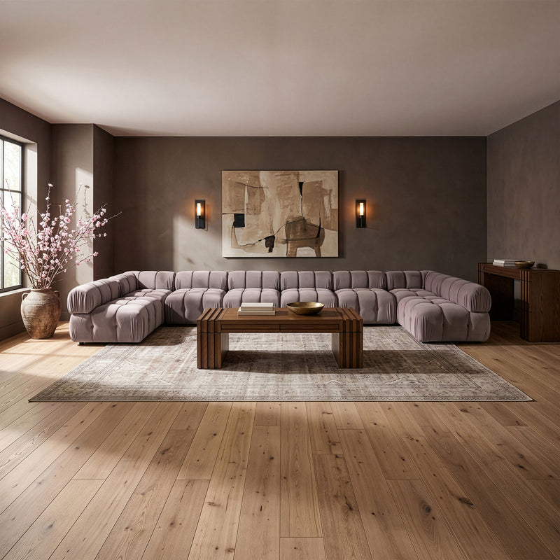 Light gray modular sectional sofa with padded chaise and corner modules