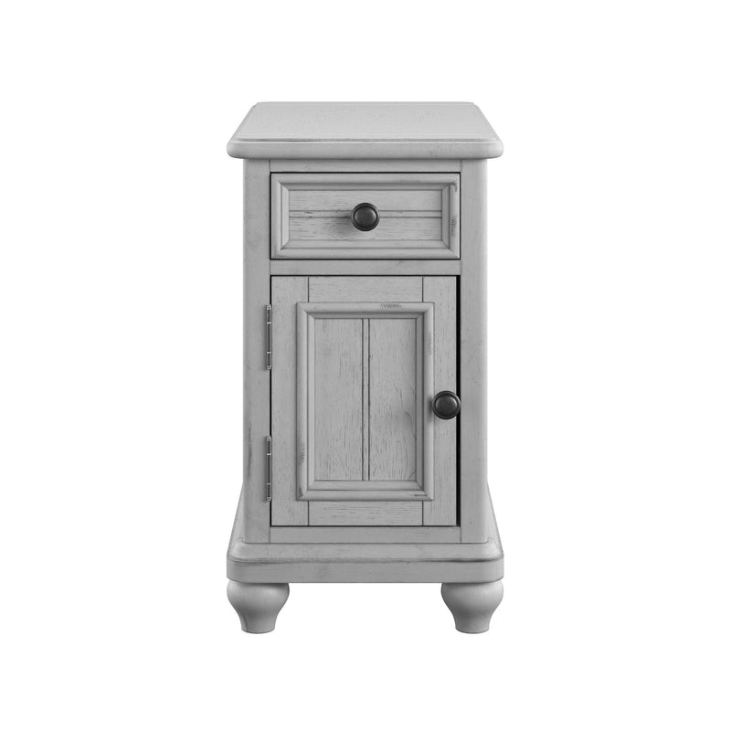 Gray narrow chairside cabinet with top drawer and paneled door