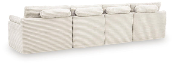 Ivory sectional sofa with striped, channel-tufted cushions and three-seat chaise