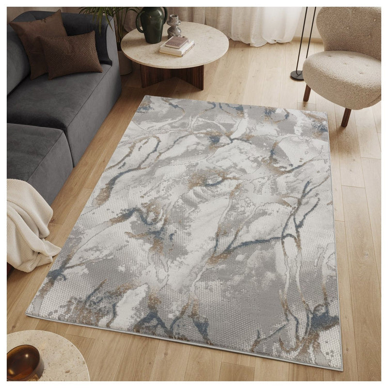 Gray area rug with marbled blue, gold, and white pattern, large rectangular layout