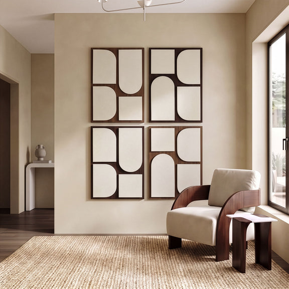 Four-piece wall art on wall with brown frames and off-white abstract shapes