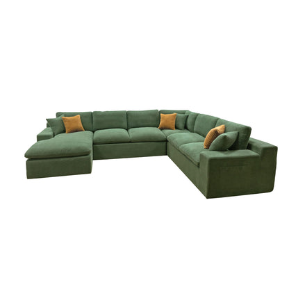 Dark green U-shaped sectional sofa with chaise seat and two mustard accent pillows