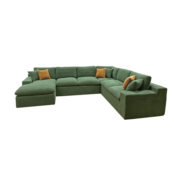 Dark green U-shaped sectional sofa with chaise seat and two mustard accent pillows