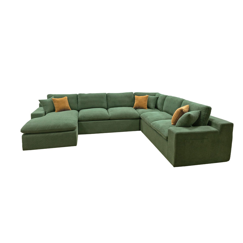Dark green U-shaped sectional sofa with chaise seat and two mustard accent pillows