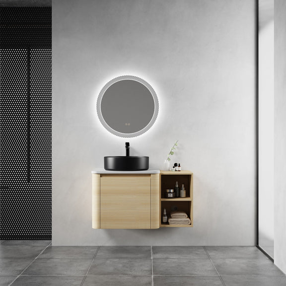 Bathroom vanity with black vessel sink, light-wood cabinet, and open side storage shelf.
