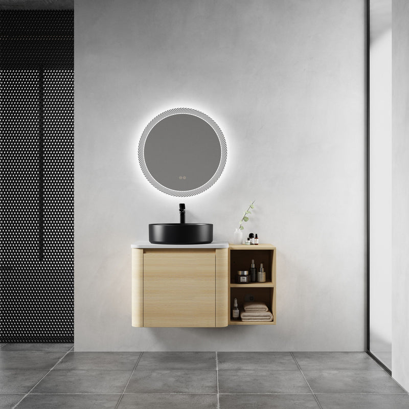 Bathroom vanity with black vessel sink, light-wood cabinet, and open side storage shelf.