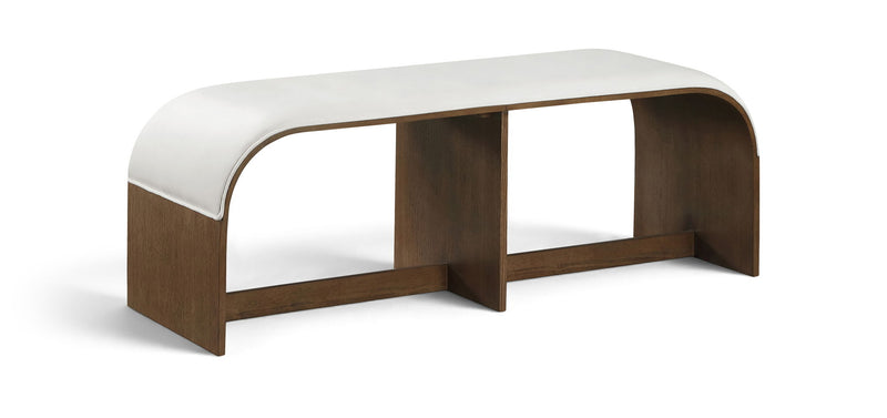 White velvet upholstered bench with rounded corners and wooden end supports
