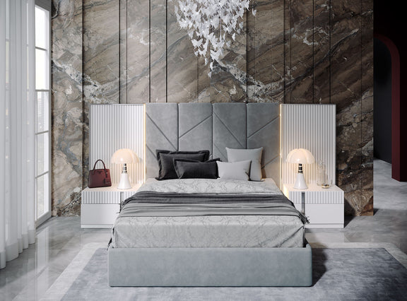 Upholstered bed with paneled light grey headboard, striped side columns, and pillows