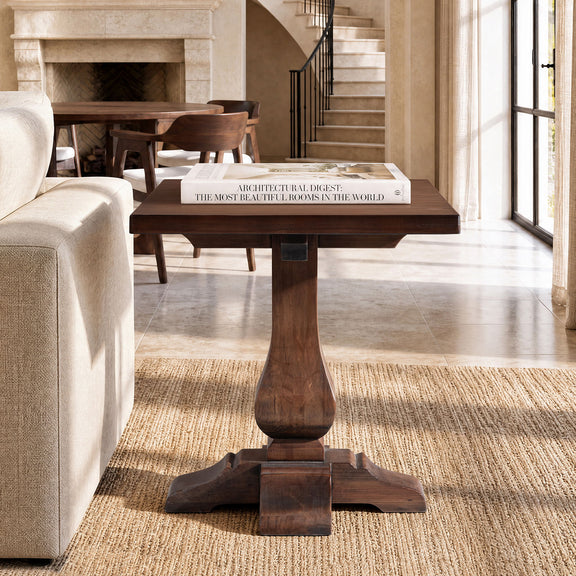Brown wooden end table with square top and pedestal base