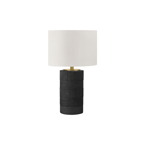Contemporary resin table lamp with black ribbed base and cream fabric shade