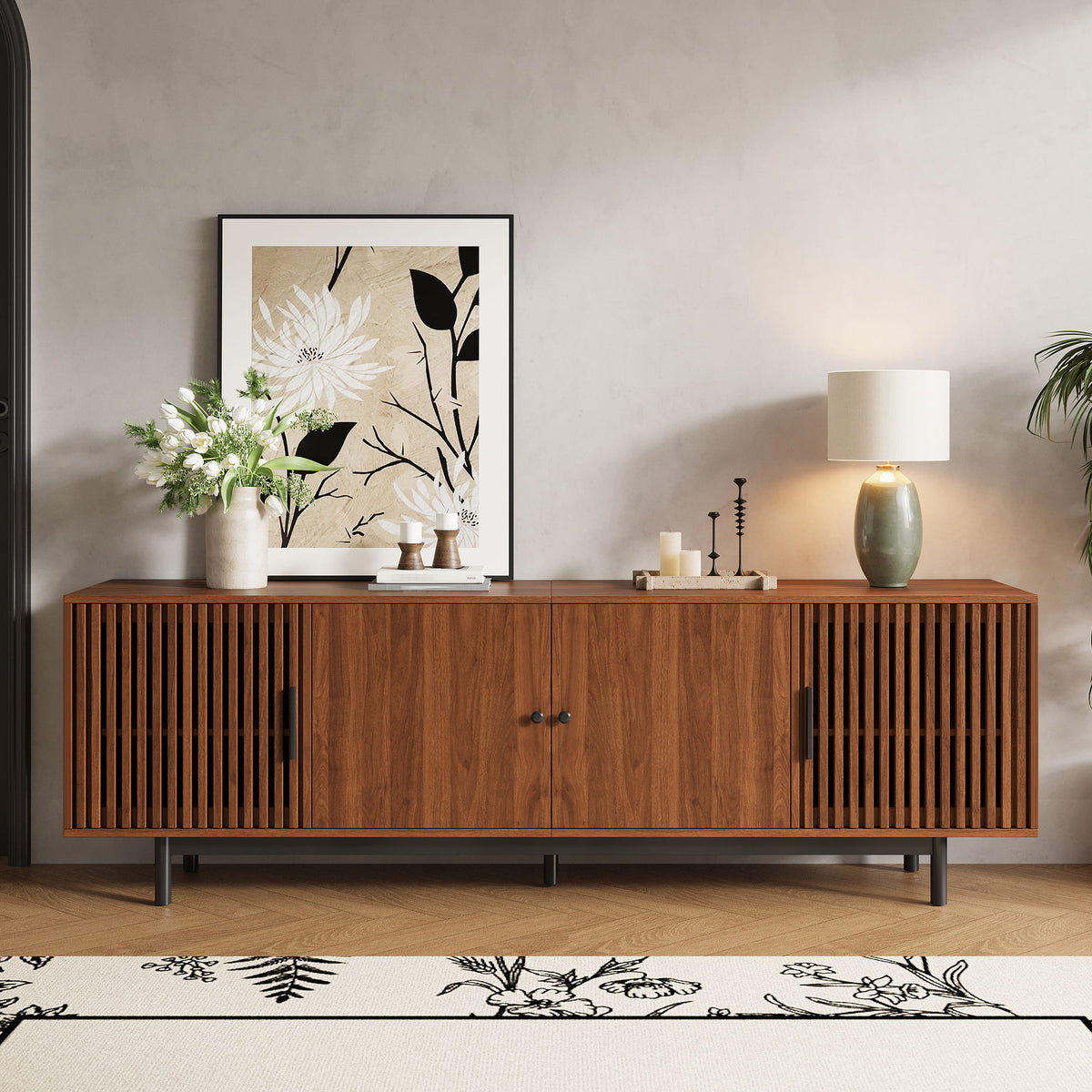 Walnut TV console with closed slatted doors and central cabinet storage.