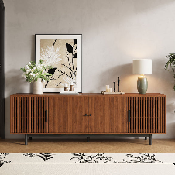 Walnut TV console with closed slatted doors and central cabinet storage.