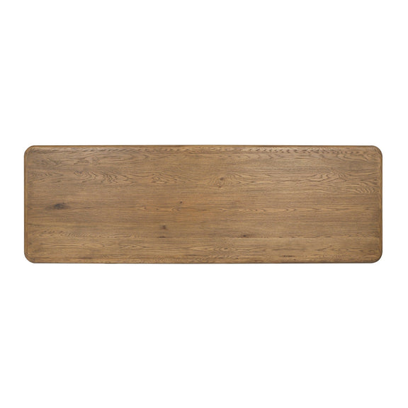 Tawny brown wooden gathering table with rounded corners and smooth plank top.