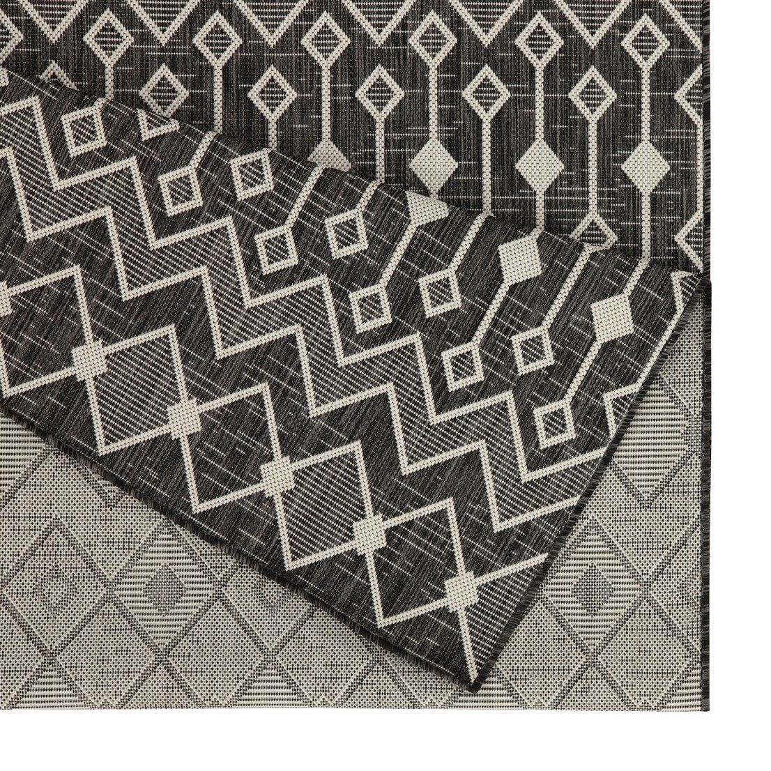 Geometric dark gray polypropylene area rug with white zigzag lattice pattern