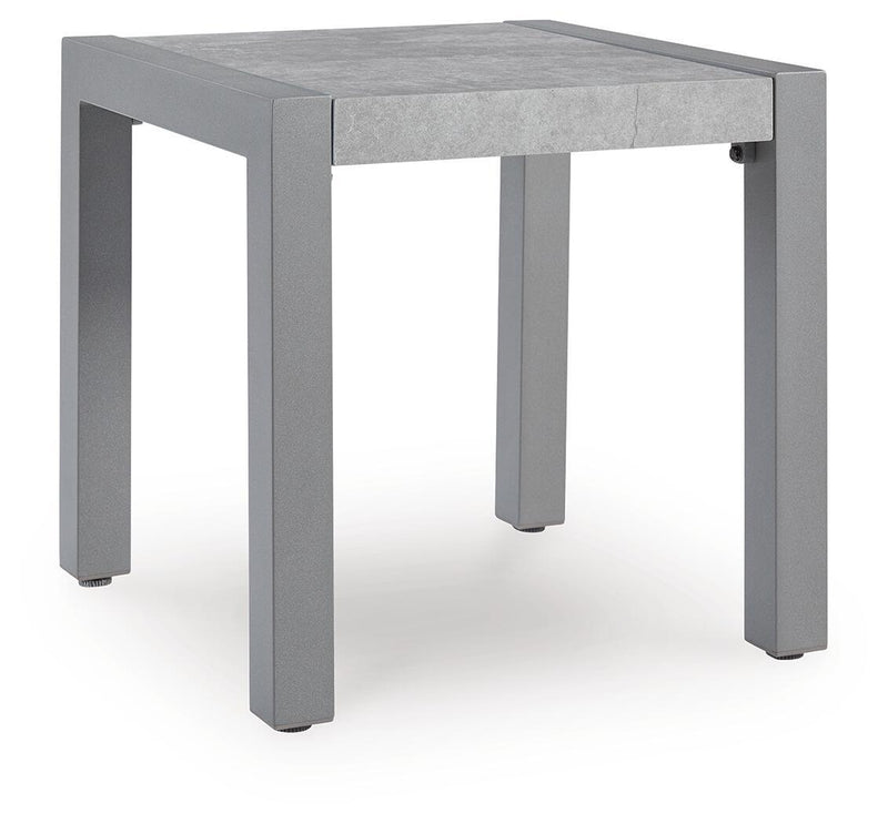 Gray rectangular table with concrete-look top and squared corner legs.