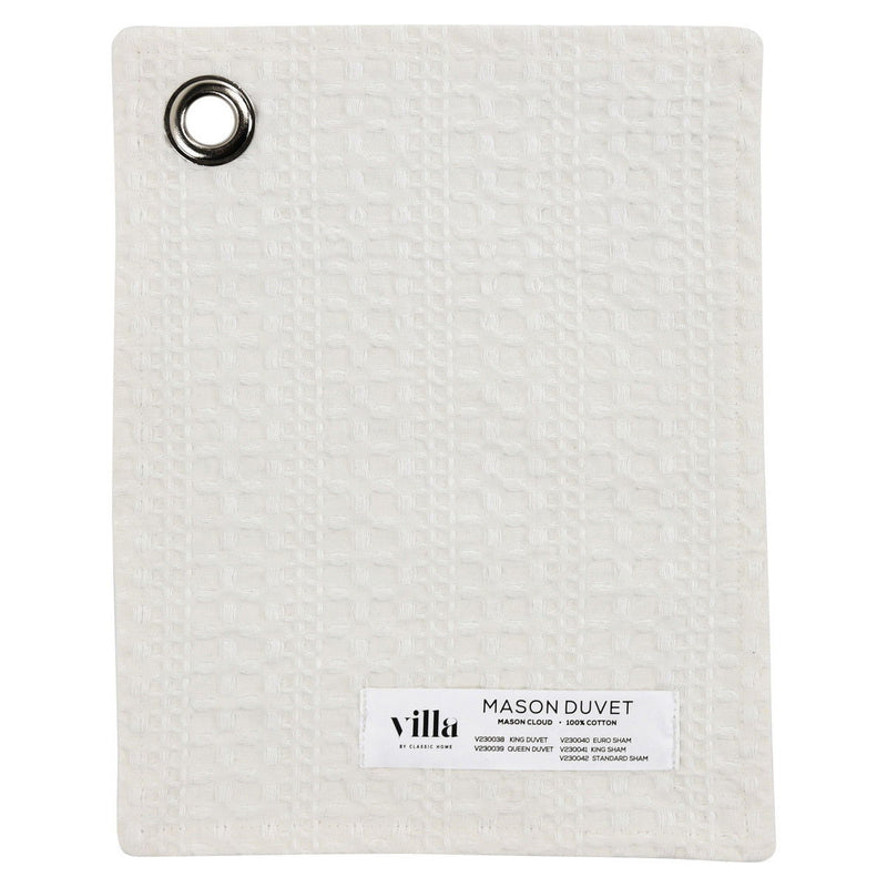 White pillow sham back with circular grommet and fabric brand label