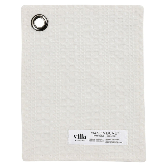 White duvet sample with fabric tag and metal grommet corner detail