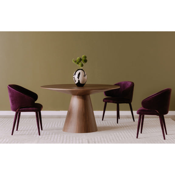 Round walnut dining table with pedestal base and four upholstered chairs