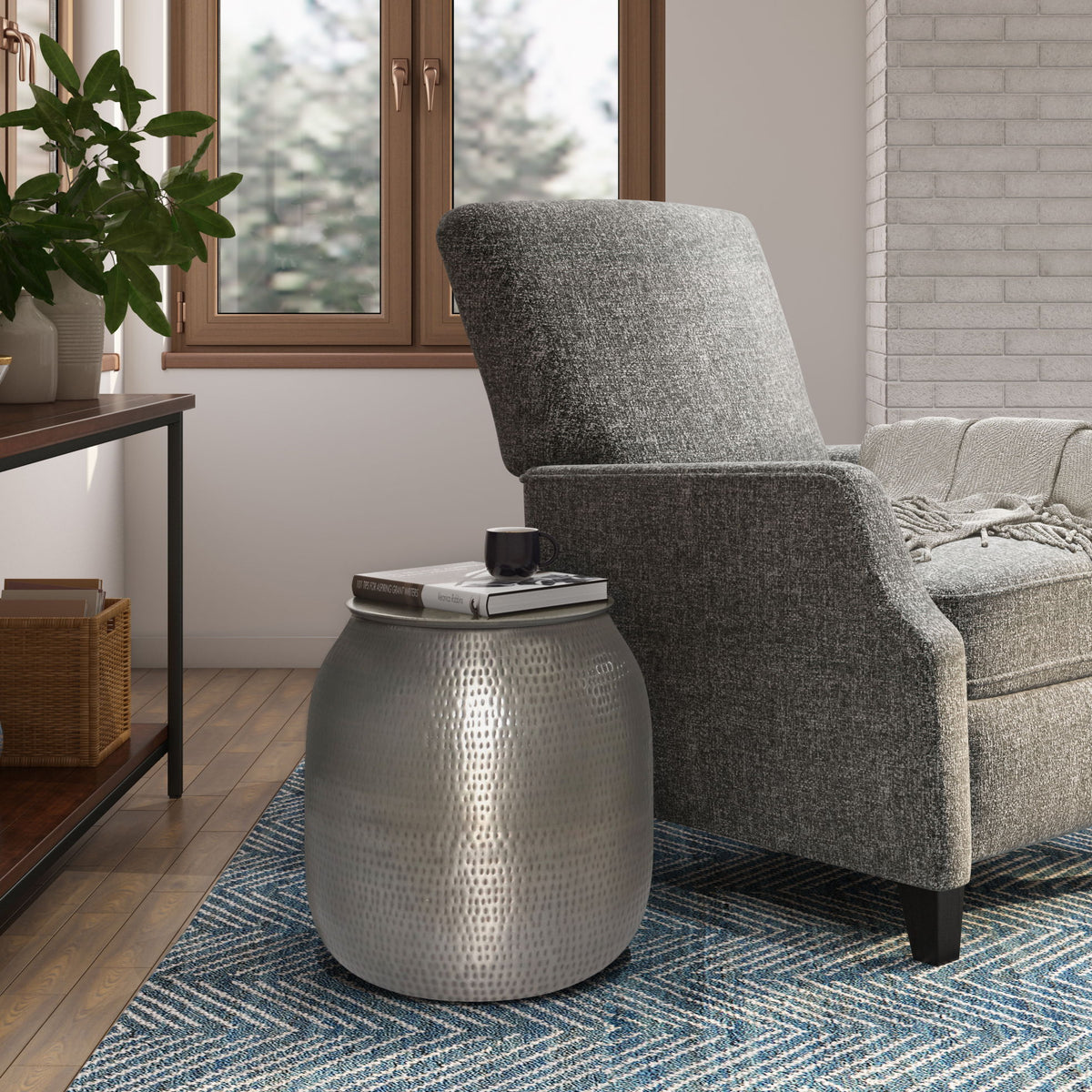 Silver-toned metal storage accent table with textured drum body and flat round lid