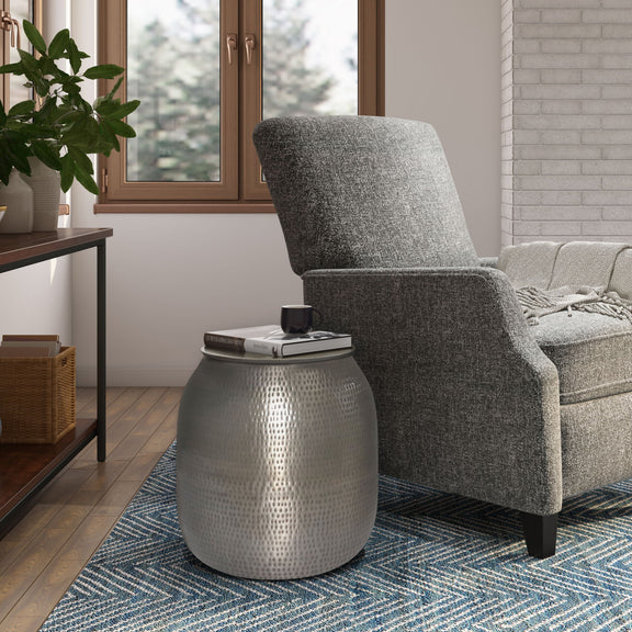 Silver-toned metal storage accent table with textured drum body and flat round lid